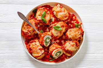 tasty chicken rollatini in tomato sauce, top view