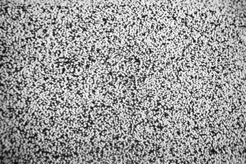 black and white Vintage TV screen with static noise caused by incorrect signal reception,...