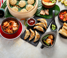 Assorted Chinese food on dark background. Asian food concept. Top view.