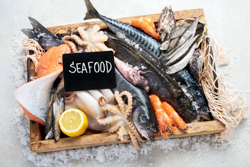 Fresh fish and seafood arrangement. Healthy eating concept. Top view..