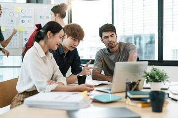 Young asian people having business meeting in office. teamwork brainstorming planning meeting concept