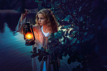 Fototapeta na wymiar Girl with lantern in hand standing in the lake behind bushes at summer night
