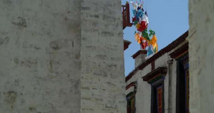 Tibet, Lhasa, China, People walking along the ancient Barkhor street Bakuo W street in summer day in cloudy we