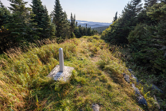 stone marker indicates international boundary between USA Canada