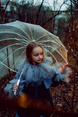 Girl with umbrella in the night forest