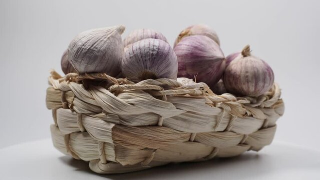 Rotating garlic on a white background.