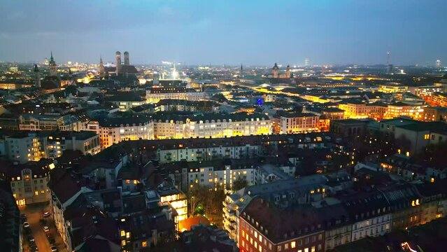 Munich night aerial skyline footage of city munich germany fly over old town frauenkirche downtown.