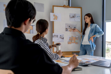 Obraz premium Architect design works drawing sketches, plans, blueprints and building architectural construction models in an architect studio.