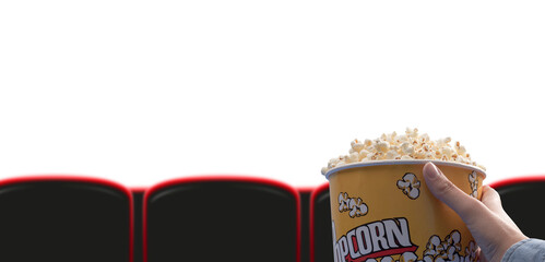 Woman eating popcorn at the movie theater