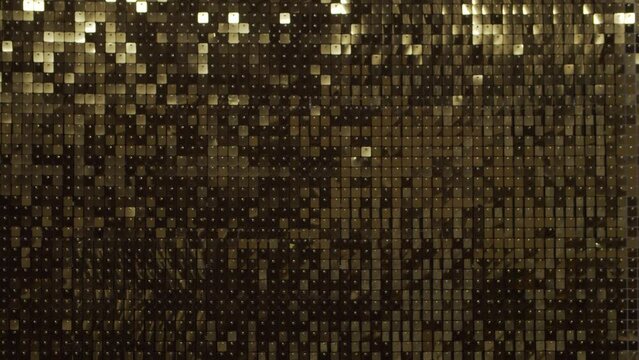 Abstract golden disco background. Moving light, reflections and glare. Music, party and dance concept.