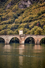 Fototapeta na wymiar Bridge on river Drina, famous historic Ottoman architecture in Visegrad, Bosnia and Herzegovina.