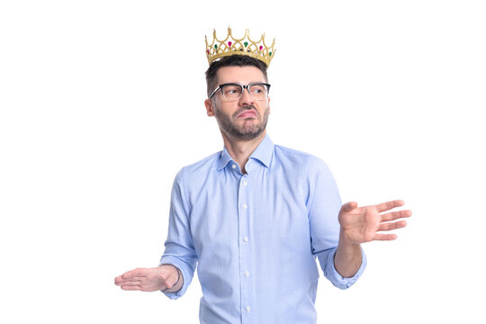 studio shot of arrogant businessman in crown. arrogant businessman in crown isolated on white
