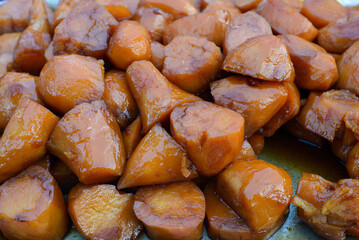 Honeyed sweet potato, typical Mexican dessert. Camote enmelado, close up.