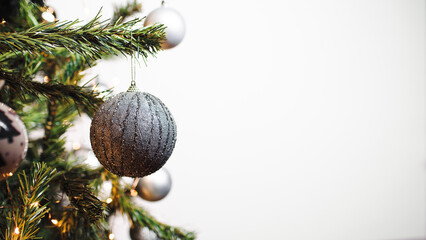 Christmas tree with white ball and copy space on right