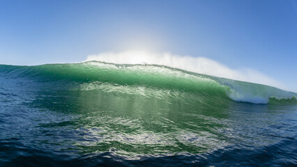 Fototapeta premium Wave Ocean Swimming Encounter Front View Face To Face Backlit Wall Water Crashing Breaking Photograph.