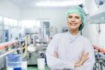 portrait woman staff worker in food and drink industry production line beverage factory happy...