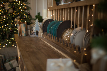 Fototapeta na wymiar Scandinavian cuisine decorated for Christmas, rustic wooden kitchen, ceramic plates