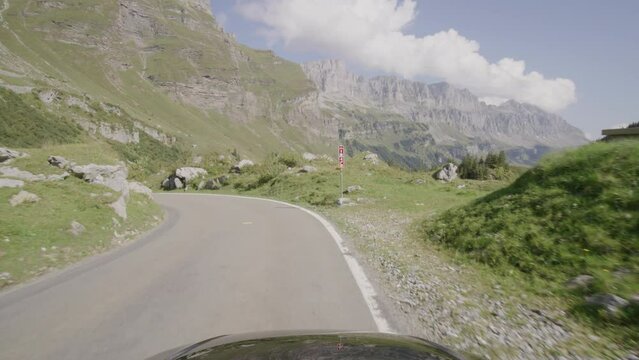 Driving video of the Sustenpass in Switzerland. The Susten pass is a famous alp road and has a scenic mountain panorama. View from the car. Experience calming nature and exciting pass roads.