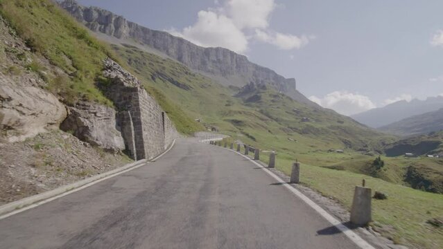 Driving video of the Sustenpass in Switzerland. The Susten pass is a famous alp road and has a scenic mountain panorama. View from the car. Experience calming nature and exciting pass roads.
