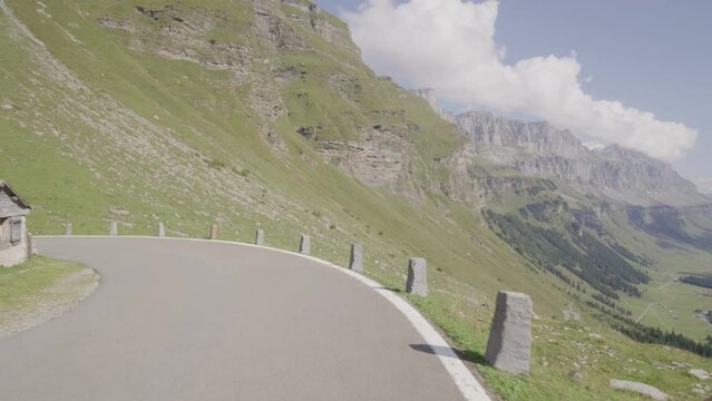 Driving video of the Sustenpass in Switzerland. The Susten pass is a famous alp road and has a scenic mountain panorama. View from the car. Experience calming nature and exciting pass roads.