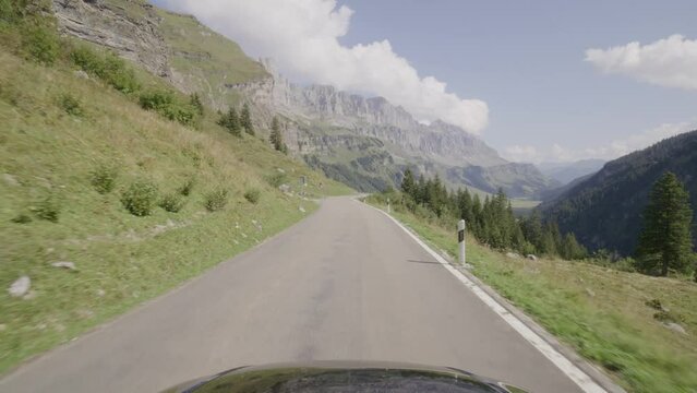 Driving video of the Sustenpass in Switzerland. The Susten pass is a famous alp road and has a scenic mountain panorama. View from the car. Experience calming nature and exciting pass roads.