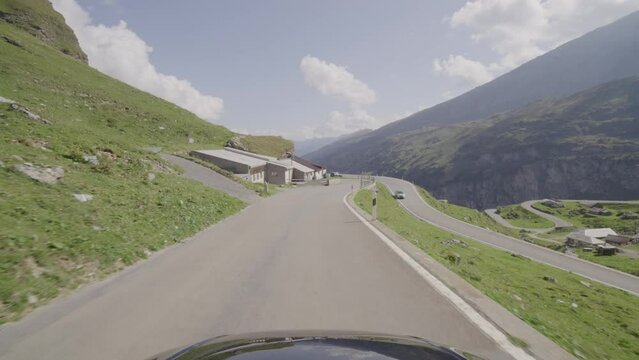 Driving video of the Sustenpass in Switzerland. The Susten pass is a famous alp road and has a scenic mountain panorama. View from the car. Experience calming nature and exciting pass roads.