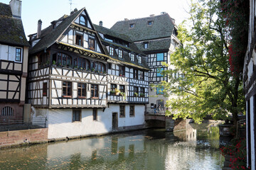 Fototapeta na wymiar Ancient Houses called timber framing.in Strasbourg in France and ILL RIVER