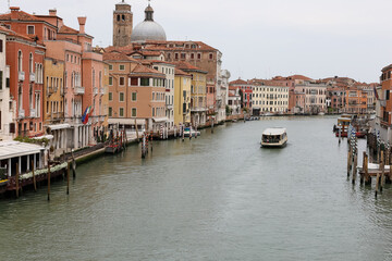 Grand Canal in Venice with only a vaporetto without people during the lockdown