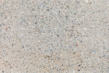 Concrete texture with small stones closeup
