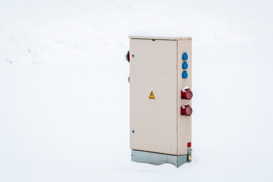Electrical cabinet in the nature in the snowdrift