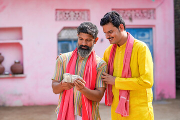 Indian farmers counting and showing money