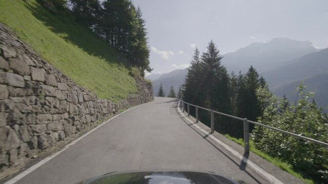 Driving video of the Sustenpass in Switzerland. The Susten pass is a famous alp road and has a scenic mountain panorama. View from the car. Experience calming nature and exciting pass roads.