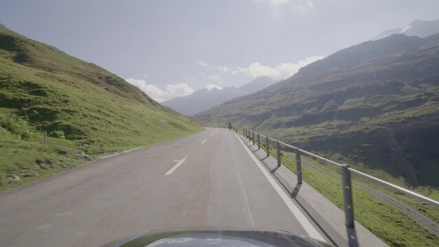 Driving video of the Sustenpass in Switzerland. The Susten pass is a famous alp road and has a scenic mountain panorama. View from the car. Experience calming nature and exciting pass roads.