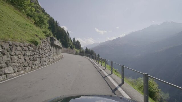 Driving video of the Sustenpass in Switzerland. The Susten pass is a famous alp road and has a scenic mountain panorama. View from the car. Experience calming nature and exciting pass roads.