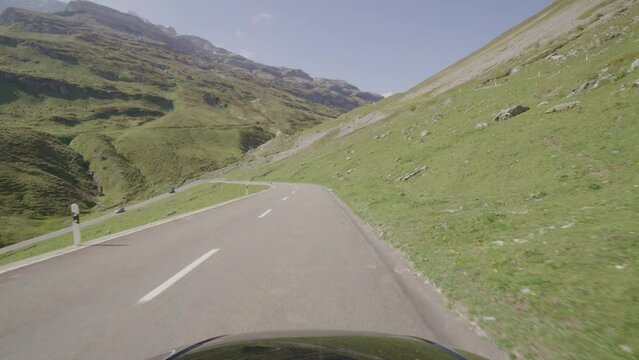 Driving video of the Sustenpass in Switzerland. The Susten pass is a famous alp road and has a scenic mountain panorama. View from the car. Experience calming nature and exciting pass roads.