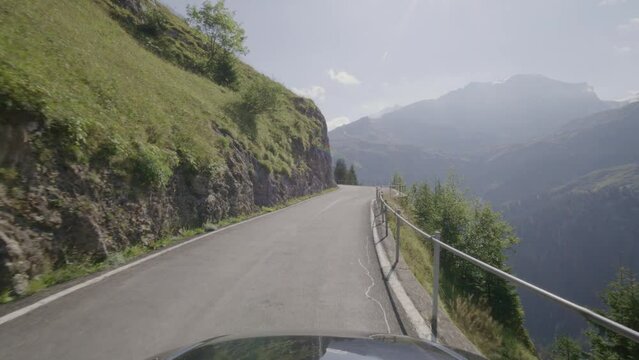 Driving video of the Sustenpass in Switzerland. The Susten pass is a famous alp road and has a scenic mountain panorama. View from the car. Experience calming nature and exciting pass roads.
