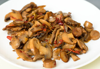 mushroom sauteed dish on a white plate