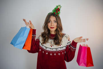 unhappy woman with christmas presents shopping bags christmas shopping