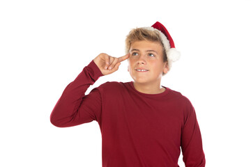 Obraz na płótnie Canvas Christmas teen boy in Santa red hat isolated on white background