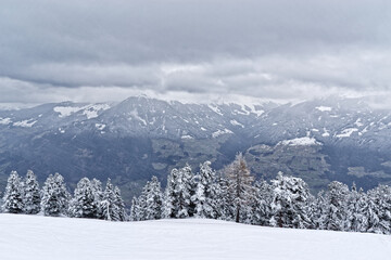 Panoramic view of winter landscape with mountains in a distance