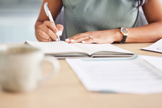 Hands, writing in notebook and planning for startup company, proposal and schedule. African American , black woman and entrepreneur make notes in book, journal and marketing strategy and ideas.
