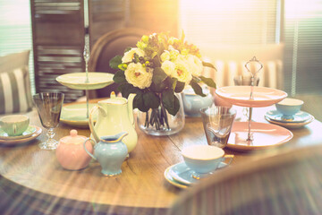 high tea table setting with sunlight coming through the window