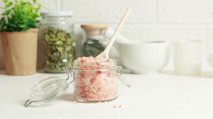 Pink Himalayan salt crystals on the kitchen table