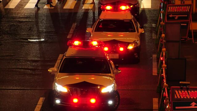 OSAKA, JAPAN - OCTOBER 2022 : Police car (red rotating beacon light) at the street. Japanese incident, case and crime concept video.