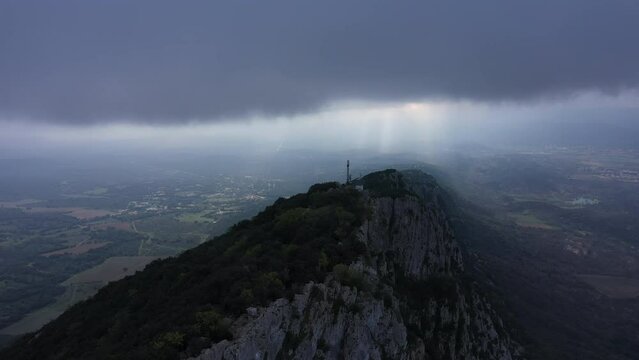 clouds over the mountain Pic Saint Loup aerial shot France Occitanie 