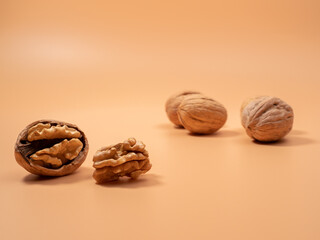 Walnut on an orange background. Raw walnut.