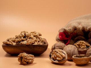 Walnut on an orange background. Raw walnut.