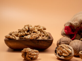 Walnut on an orange background. Raw walnut.