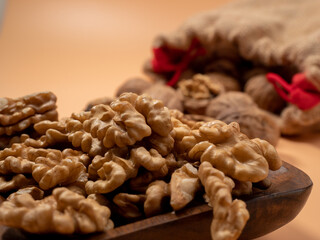 Walnut on an orange background. Raw walnut.