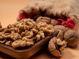 Walnut on an orange background. Raw walnut.